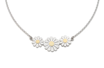 Buy handmade floral jewellery by Diana Greenwood at The Biscuit Factory. Image shows a silver necklace featuring a trio of silver daisies with gold centres.