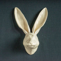View and buy unique sculpture by Jackie Summerfield online at The Biscuit Factory. Image shows the cream ceramic, 3D head of a Hare.