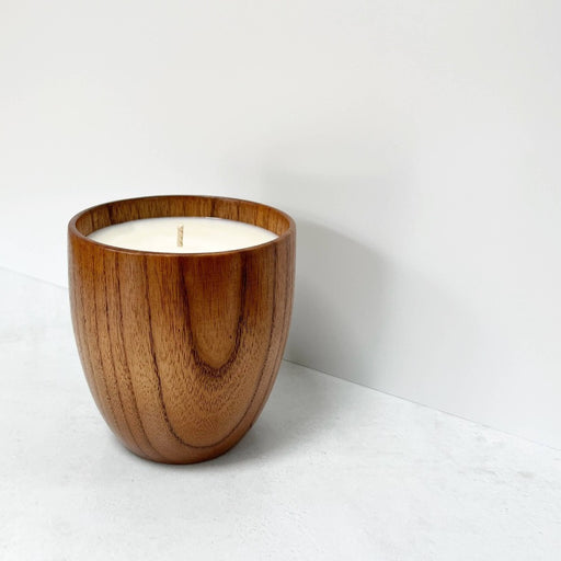 Jujube Wood Candle by Lit By Drew, a candle in a handmade wooden vessel.