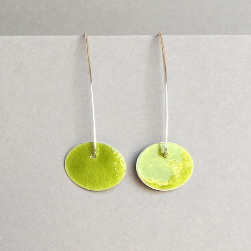 A pair of silver earrings with yellow enamel oval shapes by jeweller Annabet Wyndham, for sale at The Biscuit Factory Newcastle