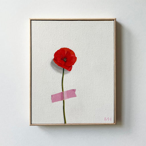 Just So by Bess Harding, an original painting of a red poppie taped to a pale background with pink tape. Framed in oak.
