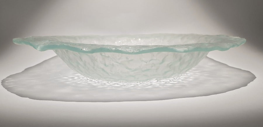 Buy 'Small Bubble Bowl III' a handmade decorative glass dish by Kate Henderson. Image shows a clear glass circular bowl with a bubble wrap texture sat on a white surface