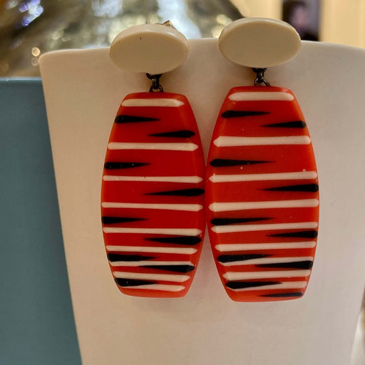 Drop Seed Earrings by Karen McMillan Jewellery, a pair of red resin earrings with dark blue and cream lines. | Colourful handmade jewellery for sale at The Biscuit Factory Newcastle