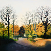 View and buy landscape paintings by Heather Blanchard at The Biscuit Factory. Image shows a countryside in Autumn with trees bare of leaves in the foregrounds and yellow and orange leaves in the background with a path leading down the centre.