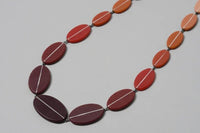 A necklace in different tones of purple and pink by jewellery designer Karen McMillan at The Biscuit Factory Newcastle