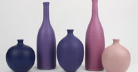 Find colourful, handmade ceramics by Lucy Burley at The Biscuit Factory Newcastle. Brighten your home with unique contemporary ceramics.  A collection of purple and pink ceramic pots