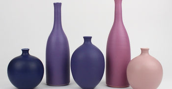 Find colourful, handmade ceramics by Lucy Burley at The Biscuit Factory Newcastle. Brighten your home with unique contemporary ceramics.  A collection of purple and pink ceramic pots