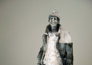 View and buy original sculpture by Alistair Brooks at The Biscuit Factory, a Newcastle art gallery. Image shows a sculpted miner in charcoals, greys and whites with a large coat and miner's lamplight helmet.