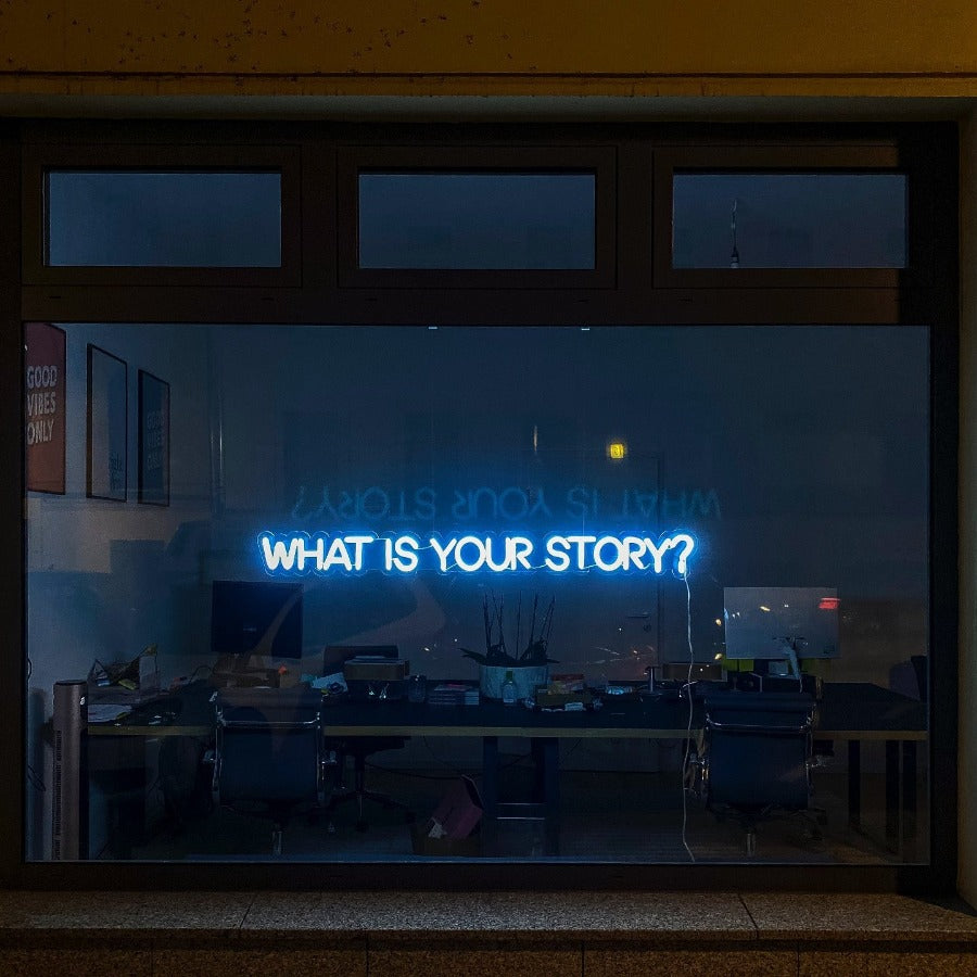 Short Story Craft workshop by Amanda Quinn at The Biscuit Factory Newcastle. | Photo of a neon window sign reading 'What Is Your Story'  by Etienne Girardet