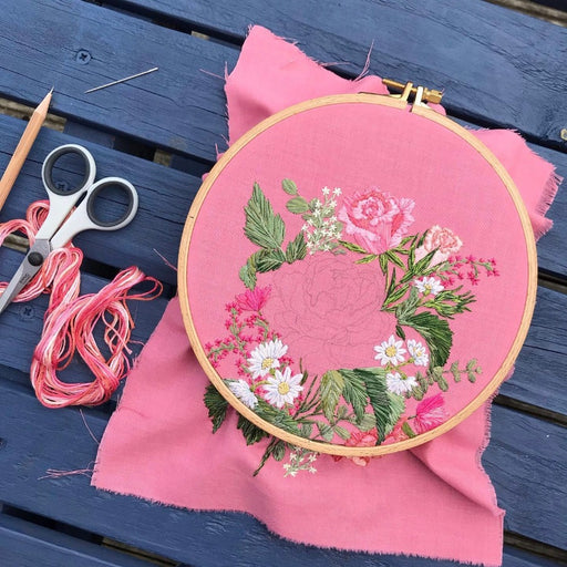 Come to a floral embroidery workshop with Lucy Freeman at The Biscuit Factory Newcastle. Image of embroidery in a hoop with scissors and thread.
