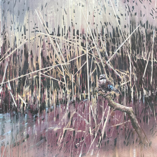 Bird perched on a branch with reeds and water in the background