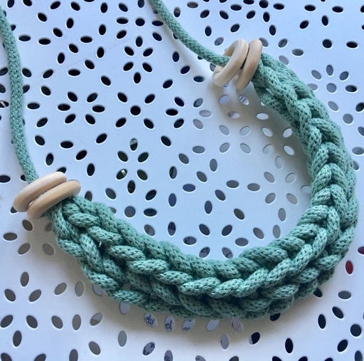 A blue woven rope necklace. Learn how to weave macrame jewellery with Kim Searle at The Biscuit Factory Newcastle.