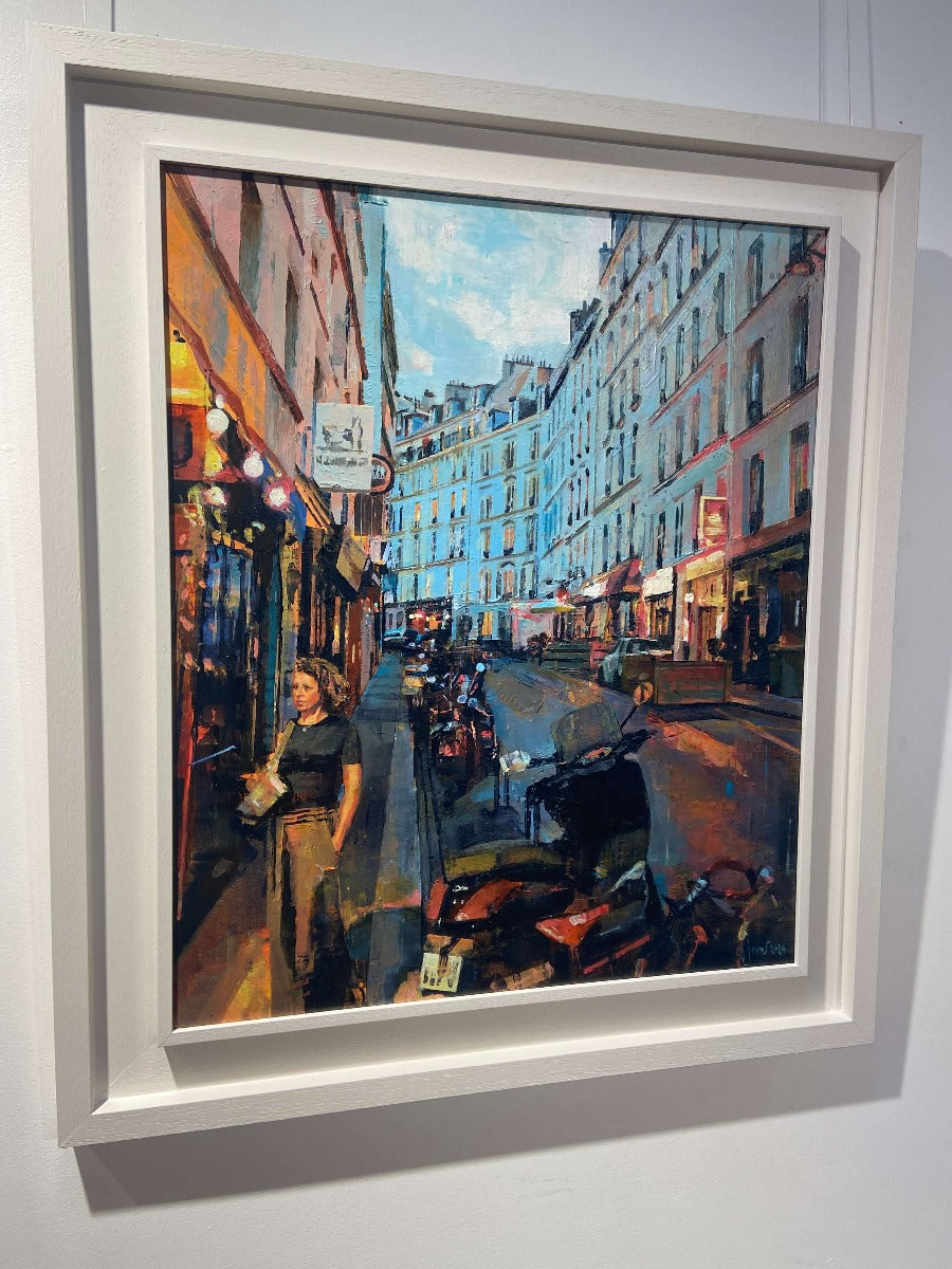 Parisian Dusk by Mark Sofilas, a white-framed oil painting of a street scene in Paris. | Original paintings for sale at The Biscuit Factory Newcastle