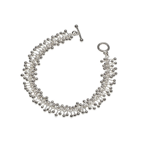 'Molecule Bracelet', silver T-bar bracelet by Yen. Image shows a silver bracelet made up of silver bars fastened to a core chain and fastened with a T-Bar sat on a white background.