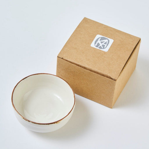 Salt Bowl by Kirsty Adams, a white porcelain bowl with bronze rim | Handmade studio ceramics for sale at The Biscuit Factory Newcastle.