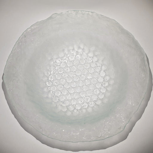 Buy 'Small Bubble Bowl III' a handmade decorative glass dish by Kate Henderson. Image shows a clear glass circular bowl with a bubble wrap texture sat on a white surface