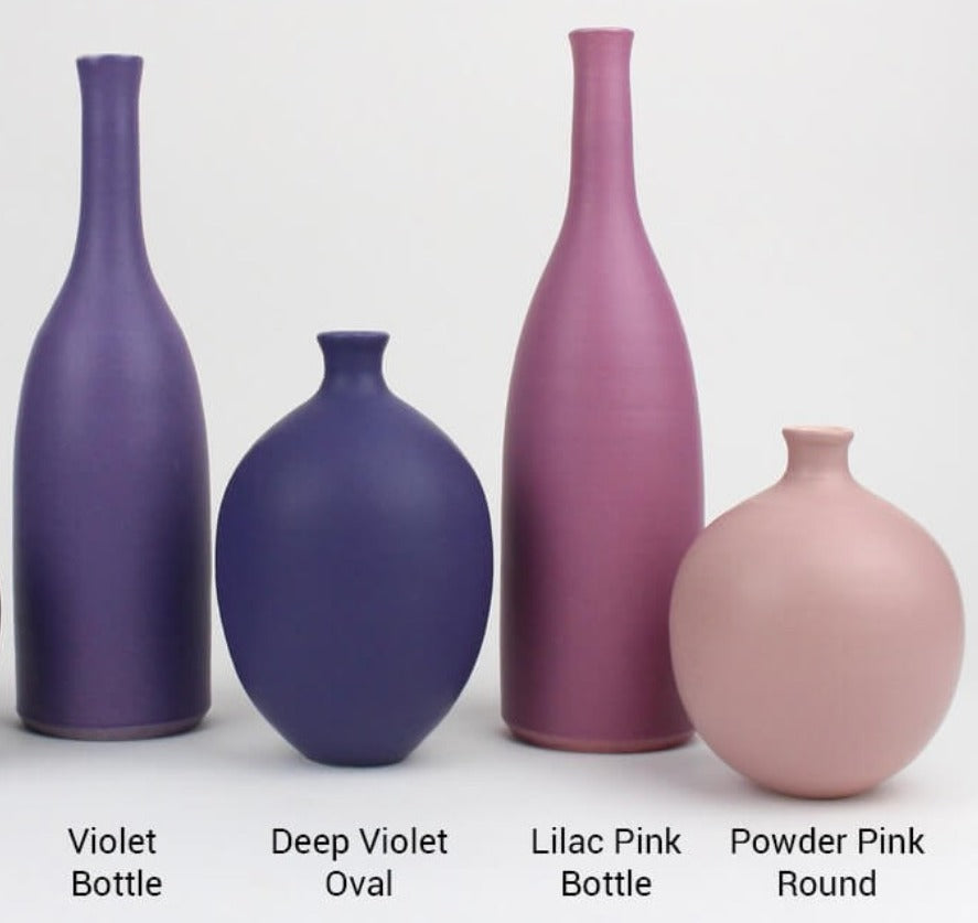 Ceramic pots by Lucy Burley, a collection of different shaped handmade pots in purples and pinks. | Colourful homewares for sale at The Biscuit Factory Newcastle