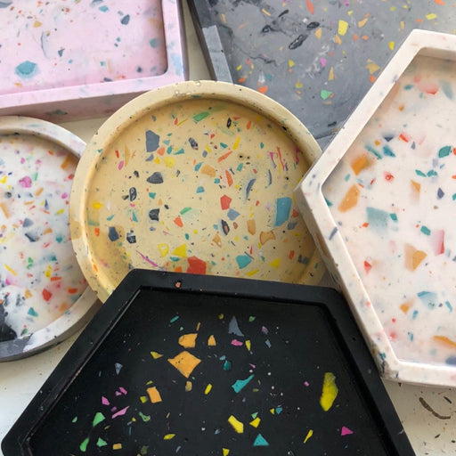 Jesmonite Coaster Workshop by Kim Searle - Darn It! Workshops. A collection of colourful jesmonite coasters. | Creative workshops at The Biscuit Factory Newcastle
