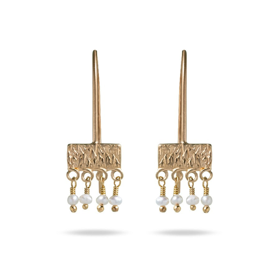 Buy handmade gold and fresh water pearl 'stamped srop' earrings by Mim Best online at The Biscuit Factory. Image shows a pair of gold earrings on a white background. Each earring has a straight wire with a textured rectangular bar across the bottom. Hanging side by side from the bottom are four spherical freshwater pearl beads.