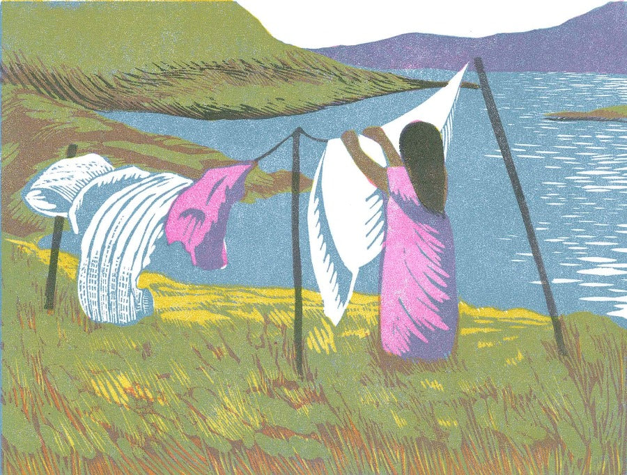 Washing Day by Cat Moore, a limited edition linocut print of a person hanging out laundry by a lakeside. | Handmade original art for sale at The Biscuit Factory Newcastle.