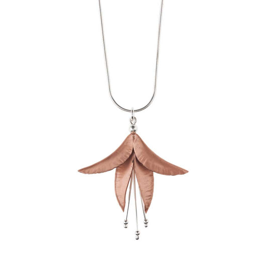 Buy 'Copper Fuchsia Pendant', a copper flower necklace by jeweller Nettie Birch. Image shows a copper fuchsia flower with silver stems hanging from a silver snake chain stretching out to the top of the frame. The necklace sits flat on a white background.