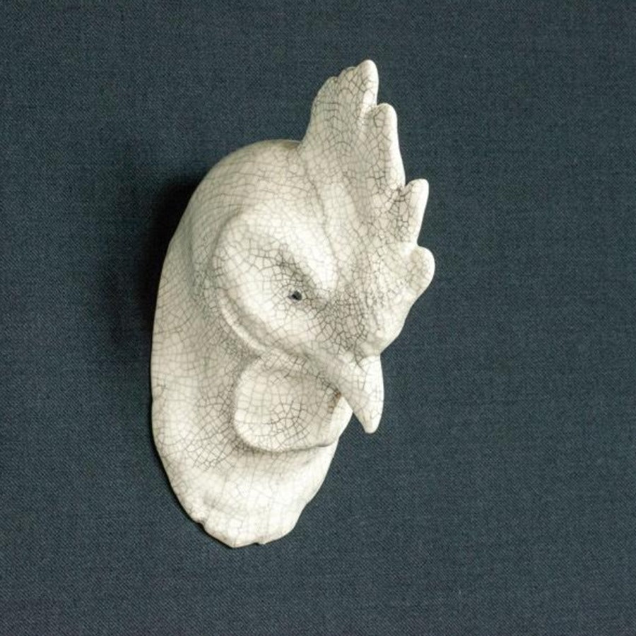 'Buy 'Chicken Head' handmade ceramic sculpture by Jackie Summerfield online at The Biscuit Factory. Image shows a ceramic sculpture of a chicken head, coloured white with a crackled glaze set against a grey background.'